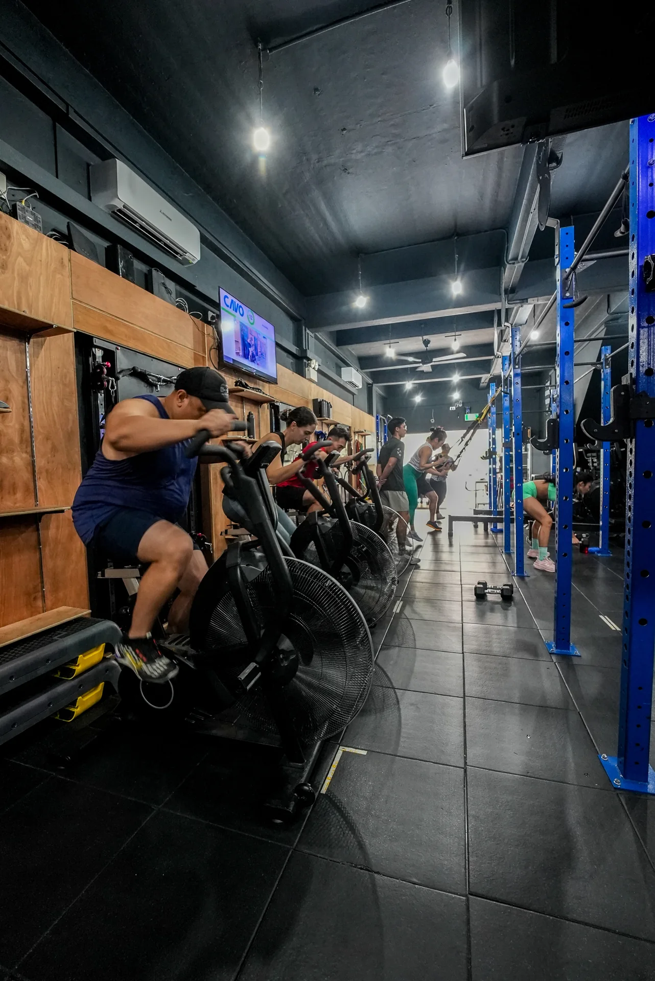 CAVO members training together on air bikes and strength stations
